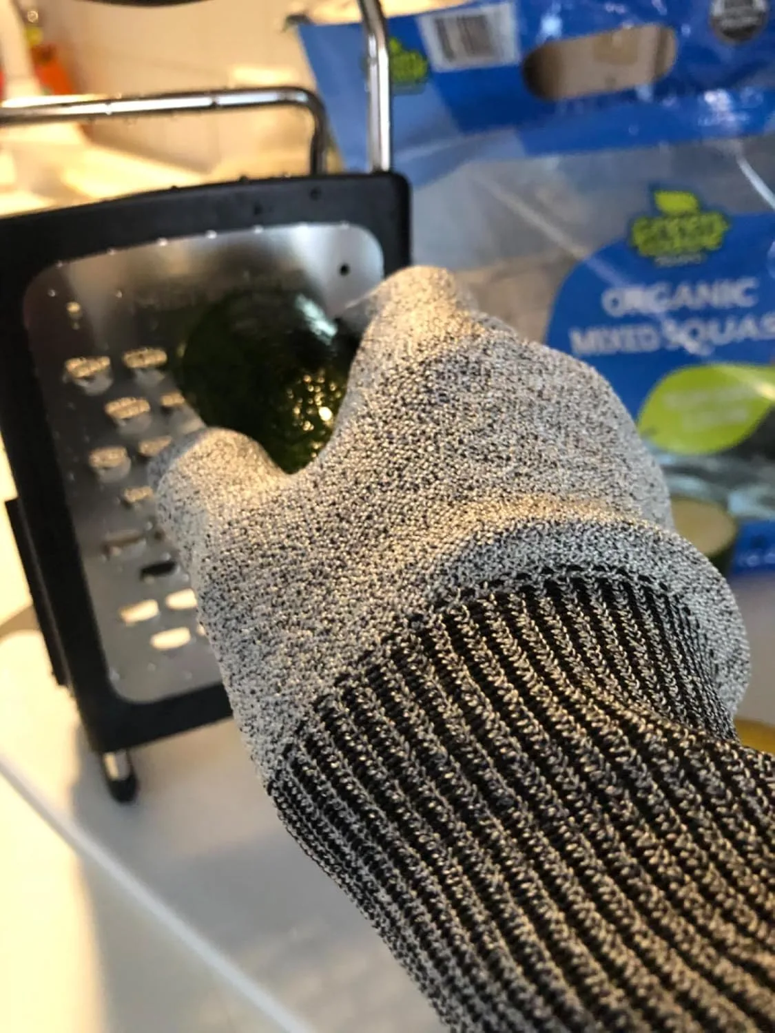 Customer photo of box grater shredding cheese for queso dip preparation