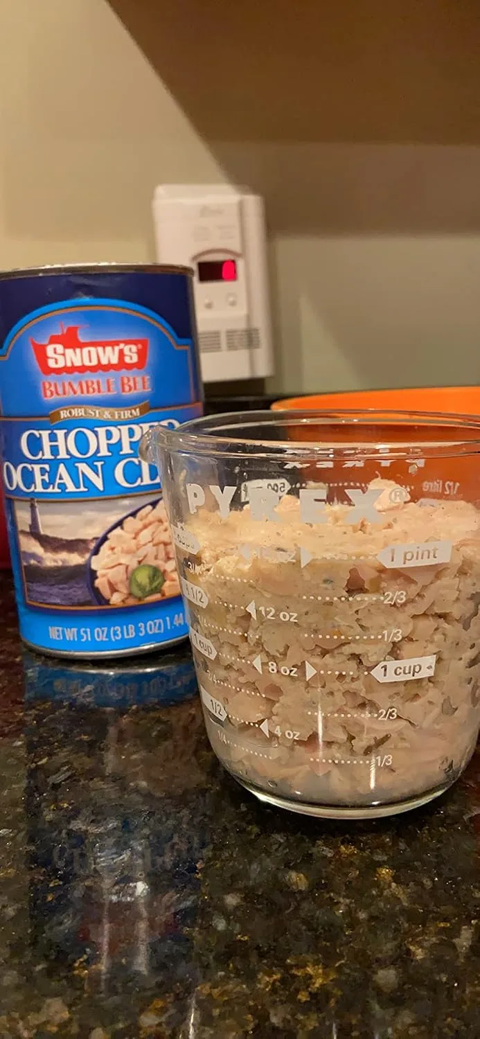 Customer photo of clam dip in a serving bowl with crackers and appetizers