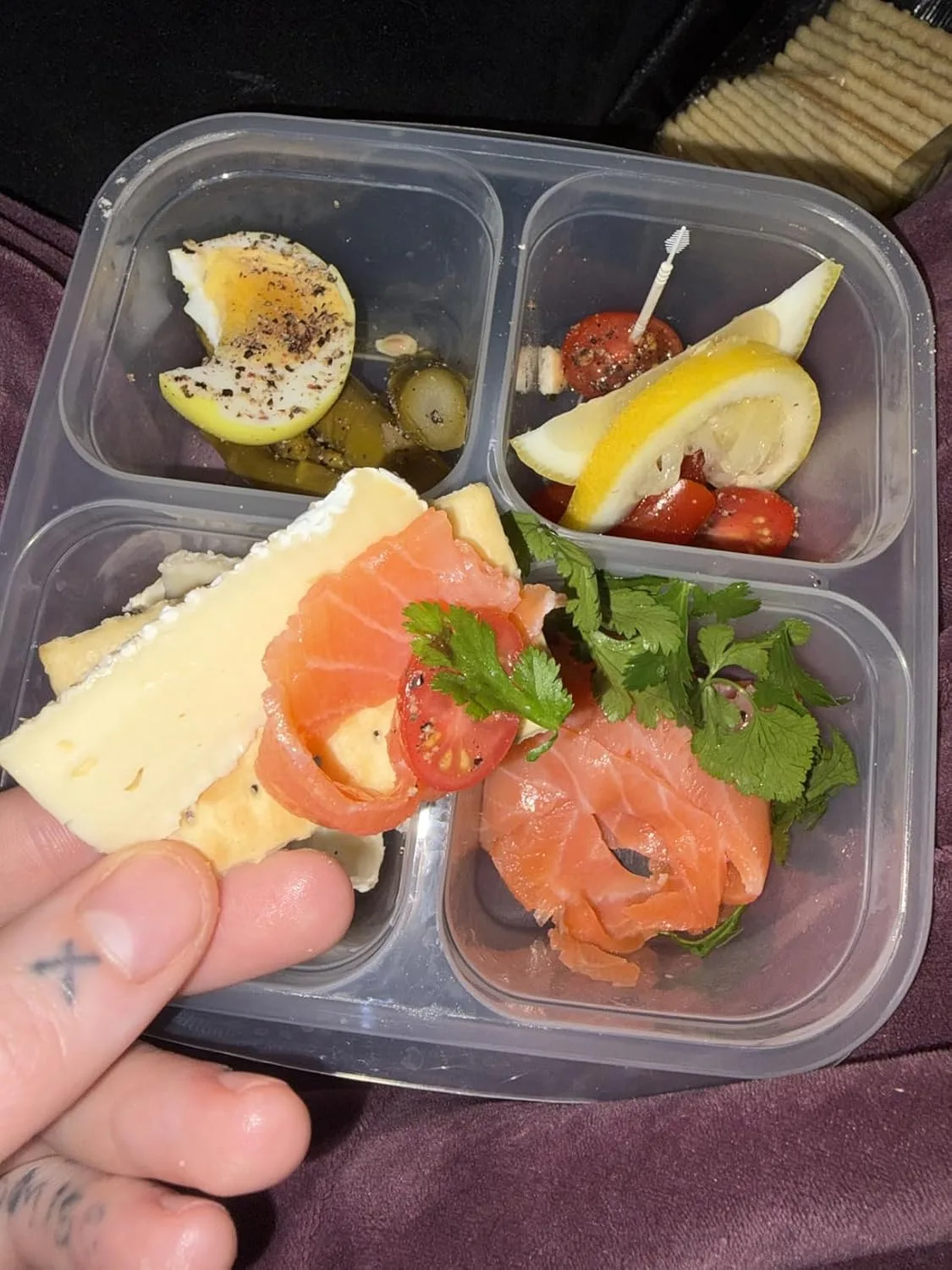 Customer photo of lox cream cheese dip in a bowl with bagel chips and crackers for serving