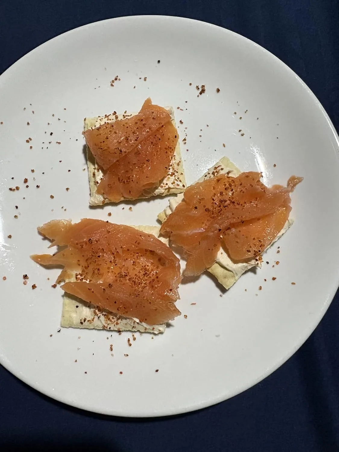 Customer photo of lox cream cheese dip served in a bowl with bagel chips and crackers for dipping
