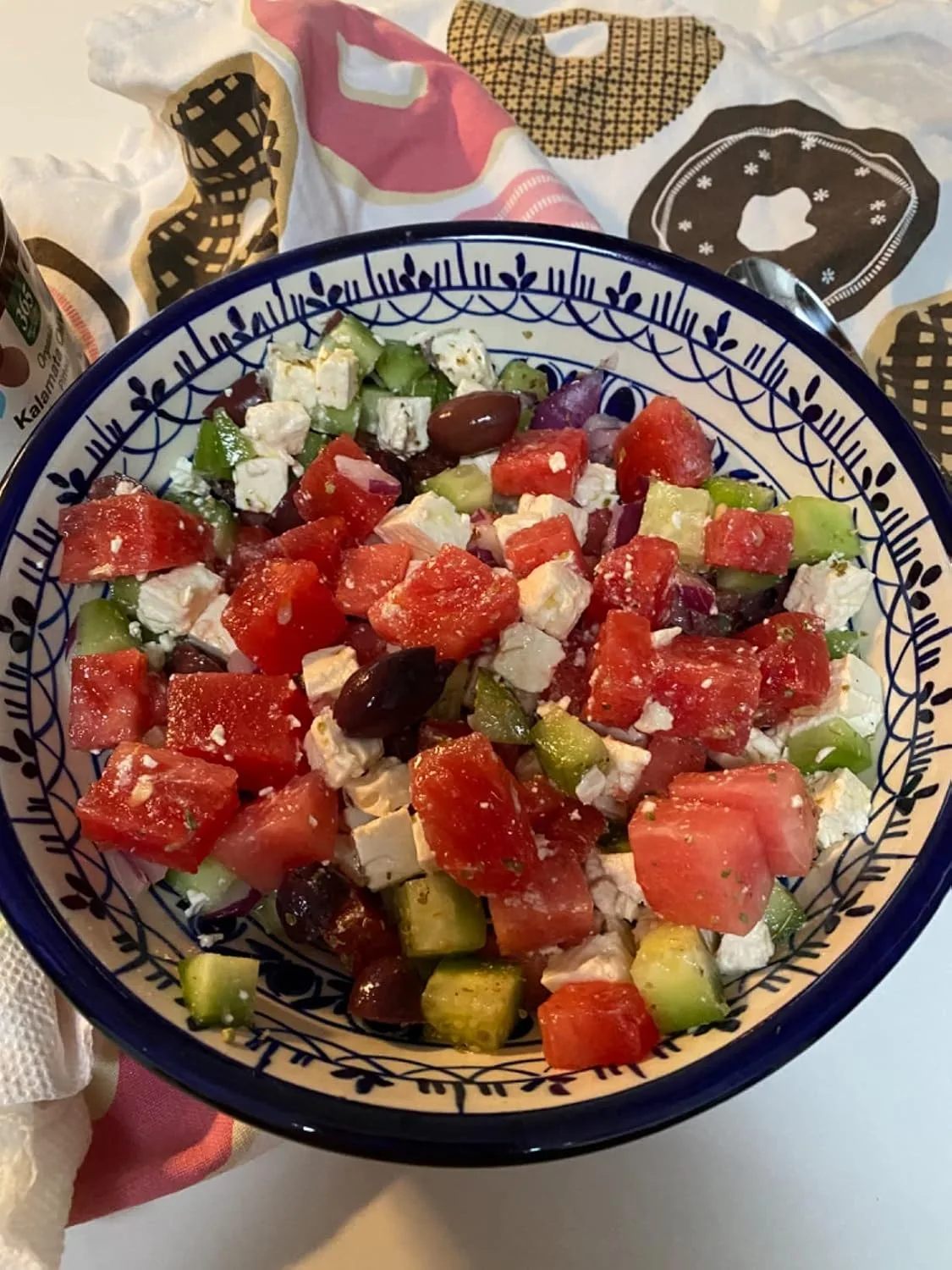 Customer photo of Greek feta dip served in a white bowl with pita chips