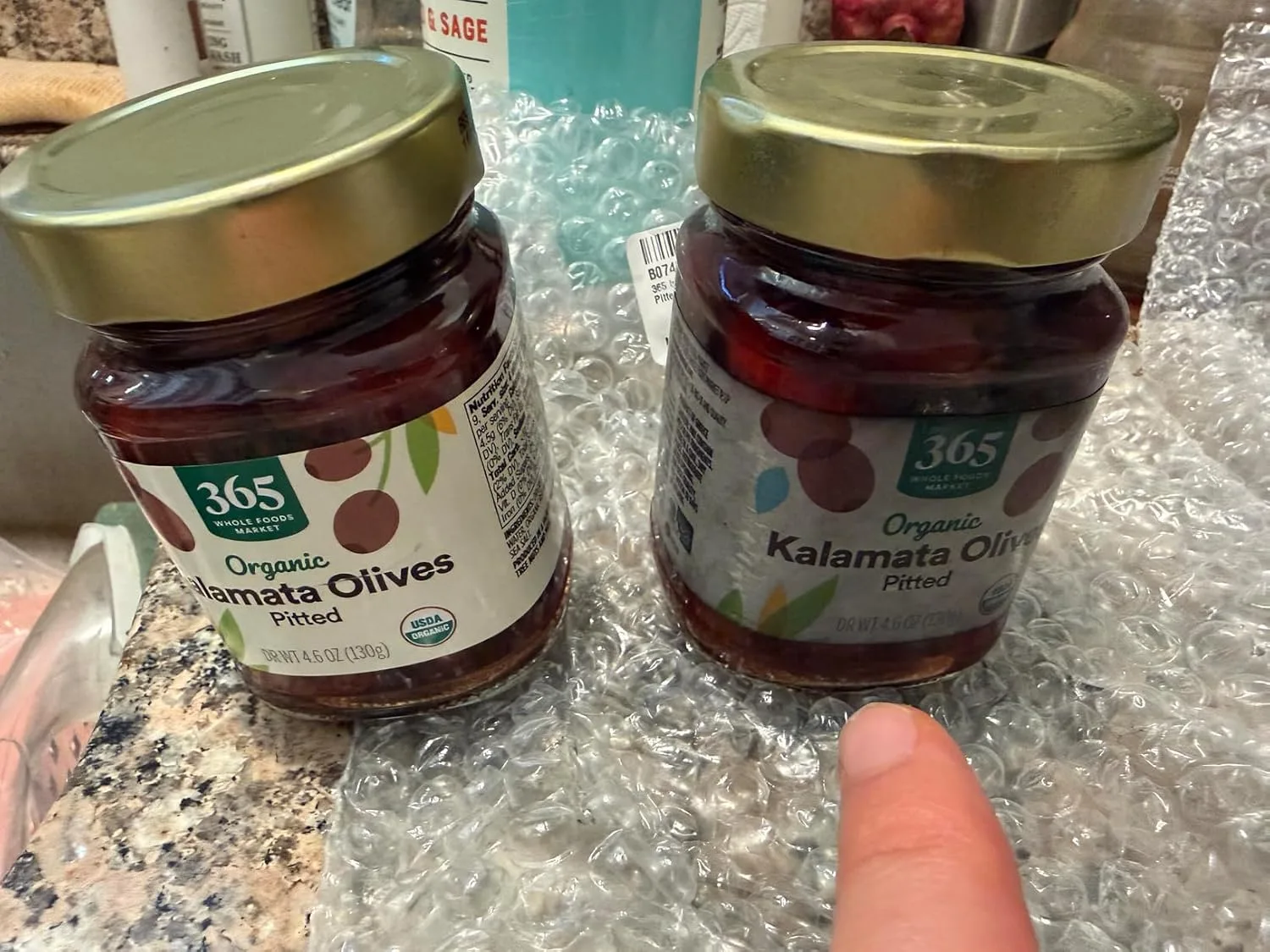 Customer photo of olive tapenade spread on crackers and bread slices