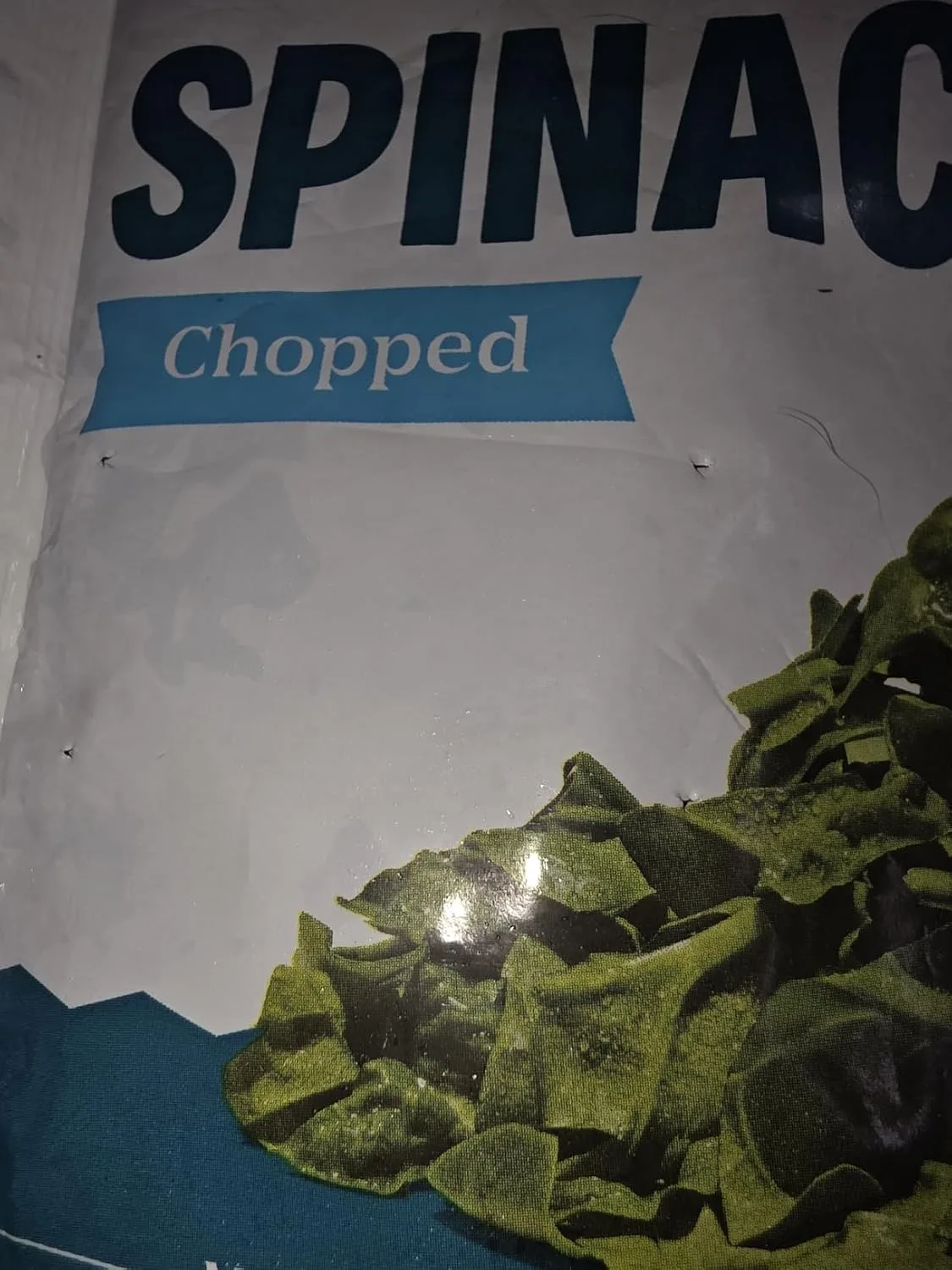 Customer photo of spinach dip served in a bowl with crackers and vegetable sides