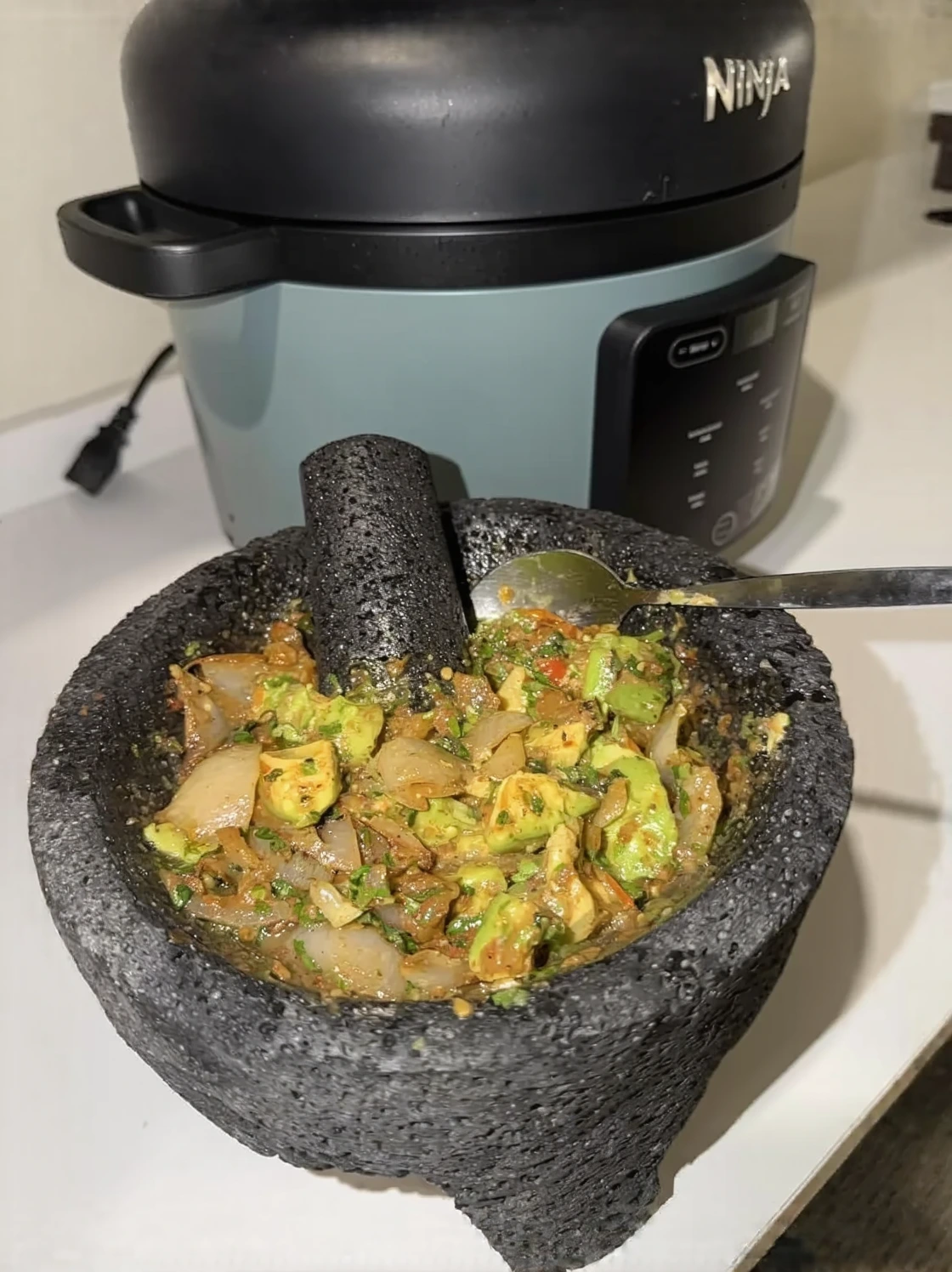 Customer photo of Mexican dip served in a bowl with tortilla chips for dipping