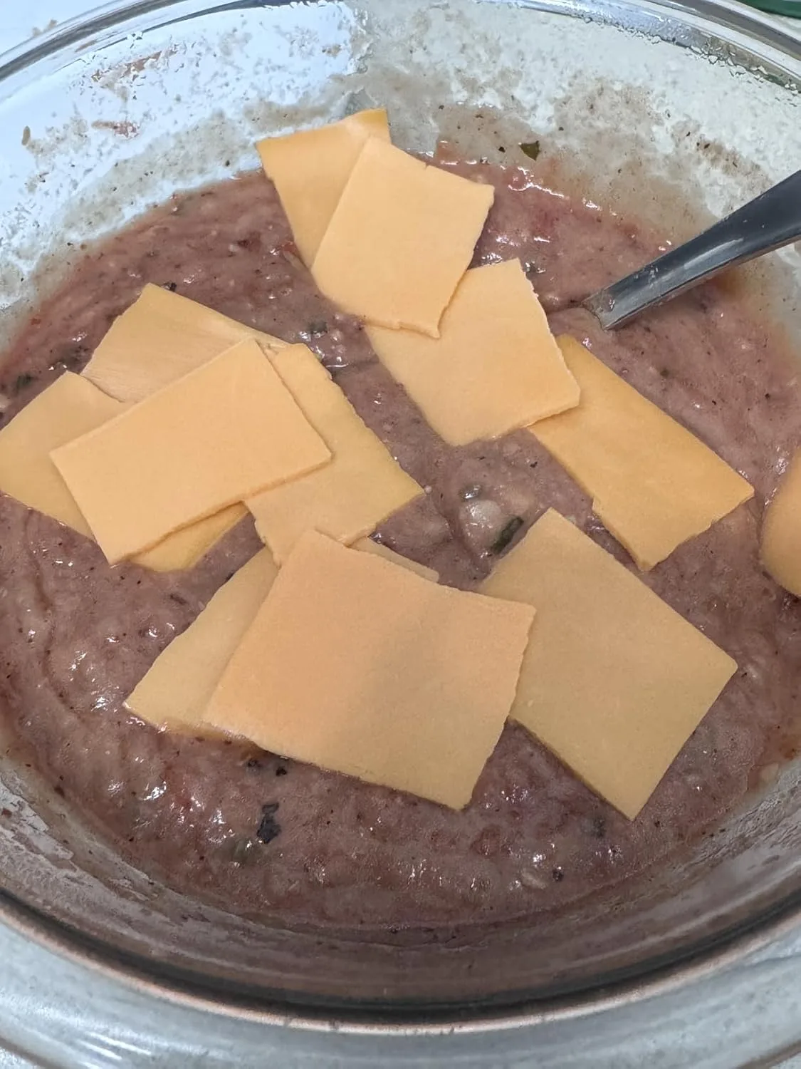 Customer photo of classic bean dip in a baking dish ready to serve