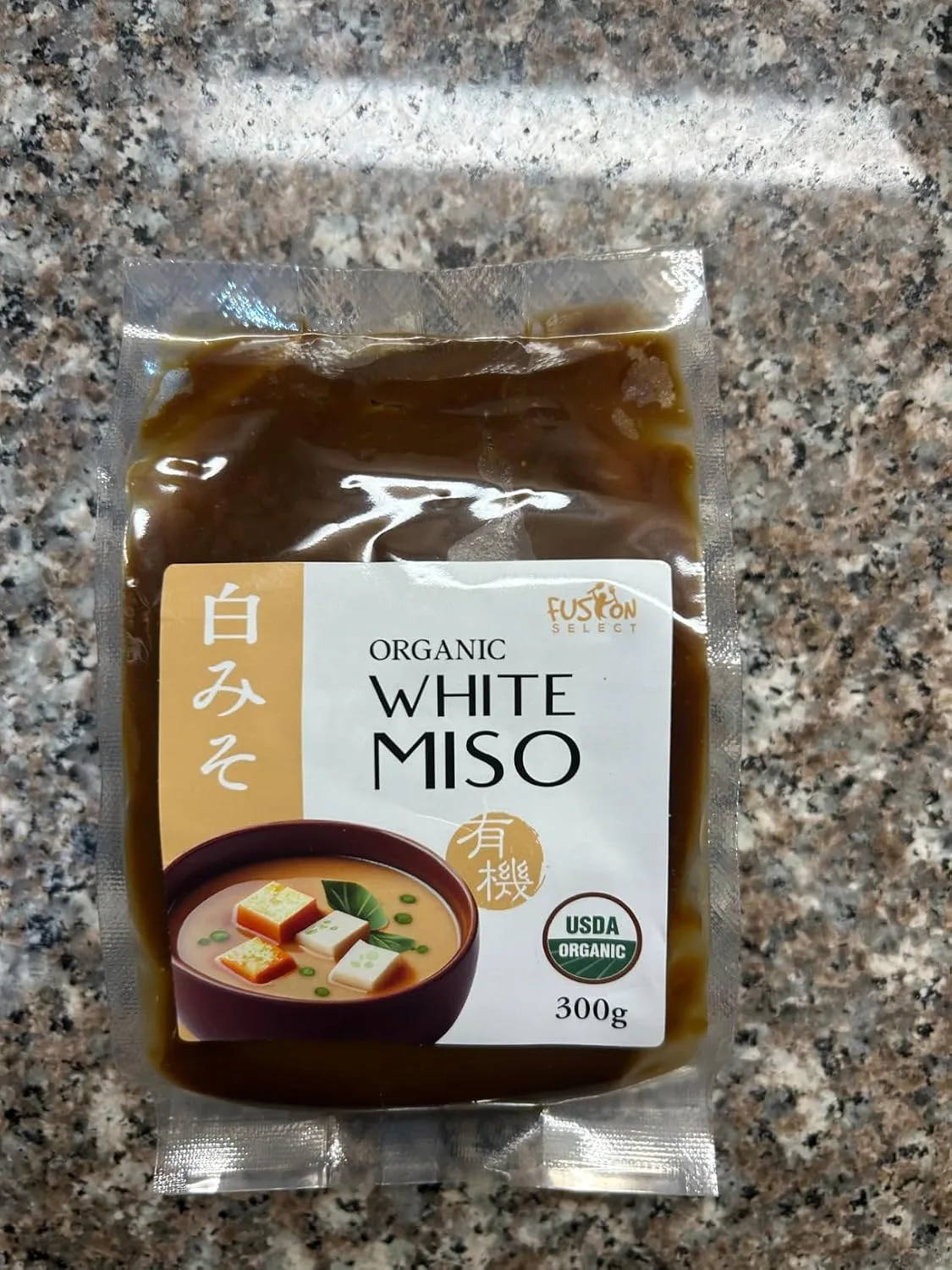 Customer photo of miso caramelized onion dip in an open container with chips nearby