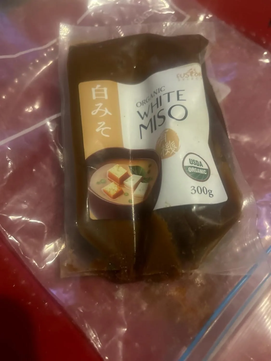 Customer photo of miso caramelized onion dip served in a bowl with chips for dipping
