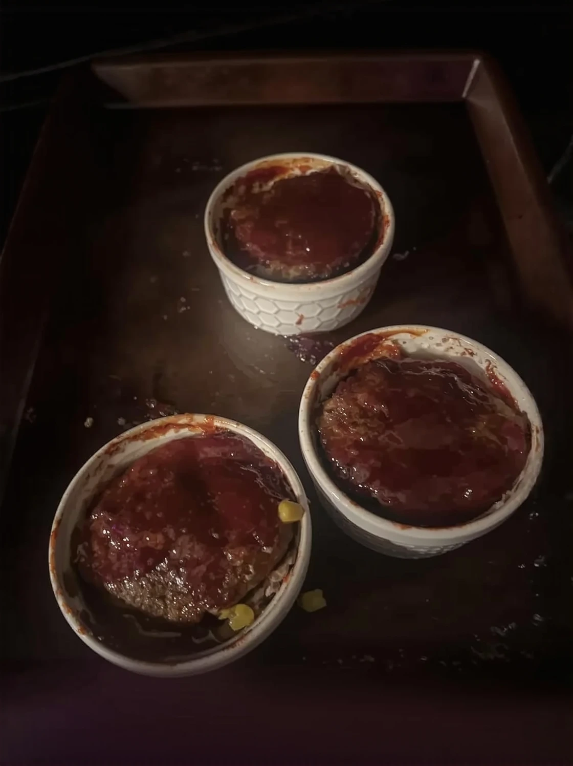Customer photo of baked cheese dip bubbling and melted in baking dish fresh from oven