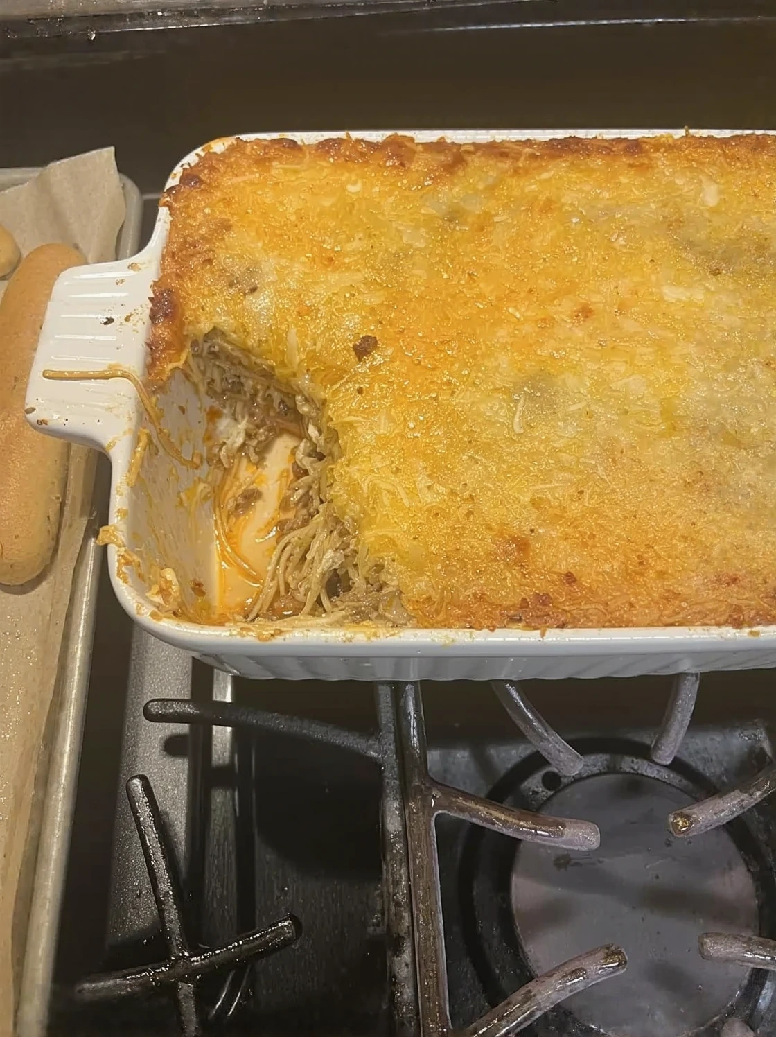 Customer photo of spinach artichoke dip in a serving bowl, showing creamy texture