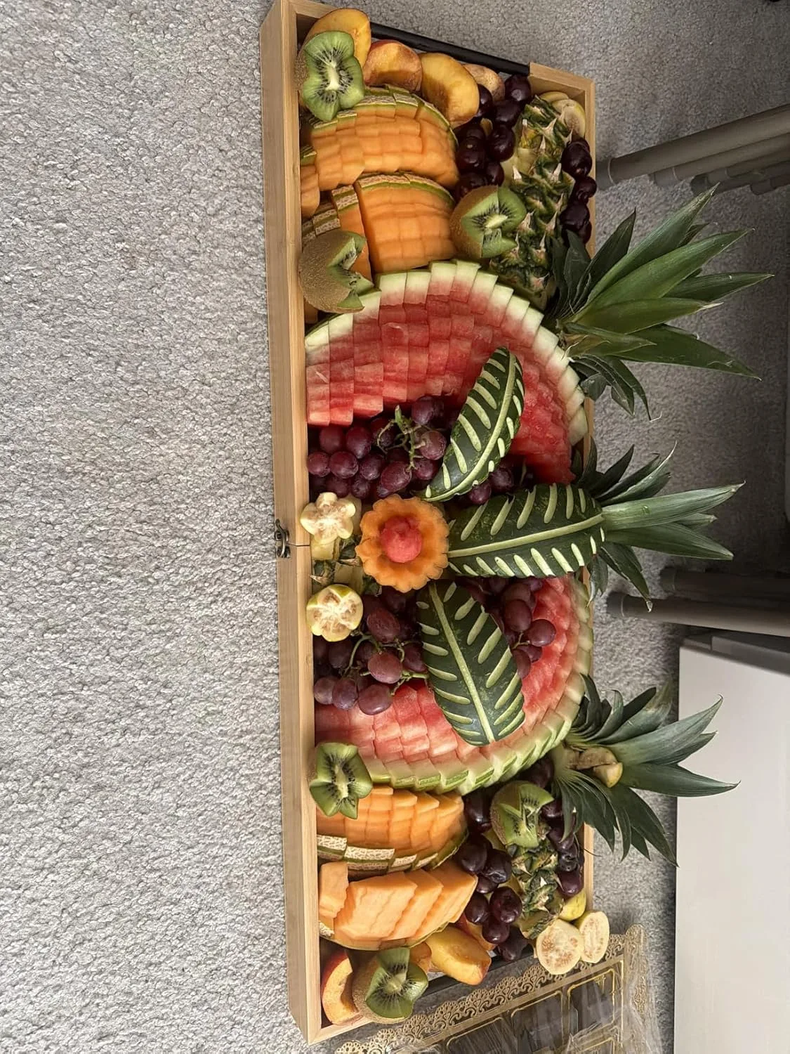 Customer photo of bamboo serving board with dips and spreads arranged on surface